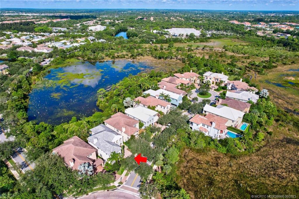 108 Tulip Tree Court Jupiter, FL 33458 - Photo 26 of 41 an aerial view of lake and residential houses with outdoor space
