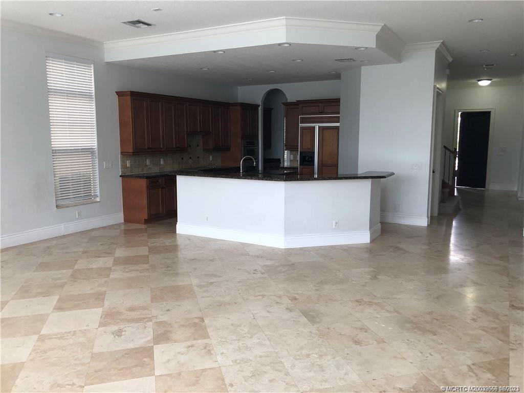 108 Tulip Tree Court Jupiter, FL 33458 - Photo 28 of 41 a view of kitchen and utility room