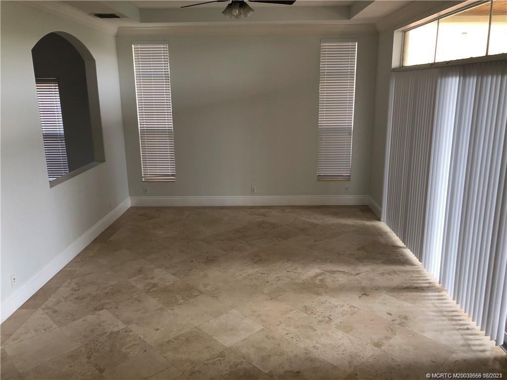 108 Tulip Tree Court Jupiter, FL 33458 - Photo 30 of 41 an empty room with windows