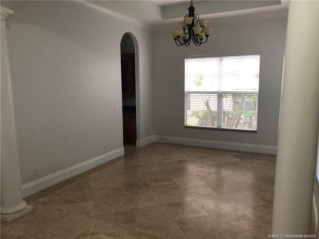 108 Tulip Tree Court Jupiter, FL 33458 - Photo 31 of 41 a view of an empty room with a window