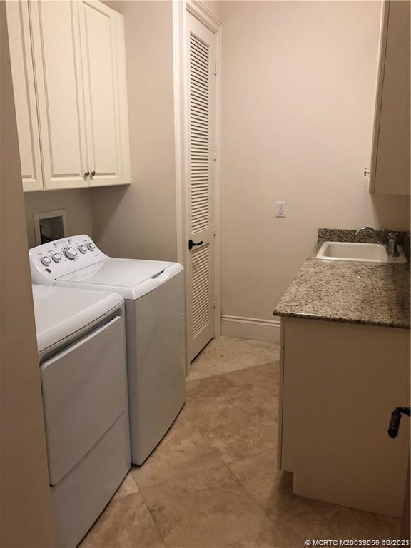 108 Tulip Tree Court Jupiter, FL 33458 - Photo 36 of 41 a utility room with dryer and washer