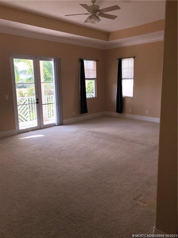 108 Tulip Tree Court Jupiter, FL 33458 - Photo 37 of 41 a view of an empty room with a window