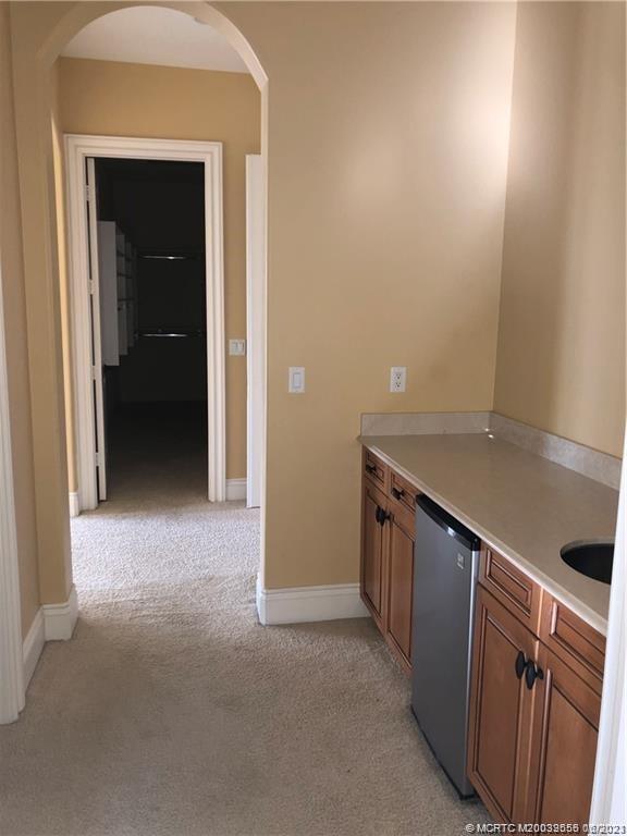 108 Tulip Tree Court Jupiter, FL 33458 - Photo 39 of 41 a view of an empty room with kitchen and a window
