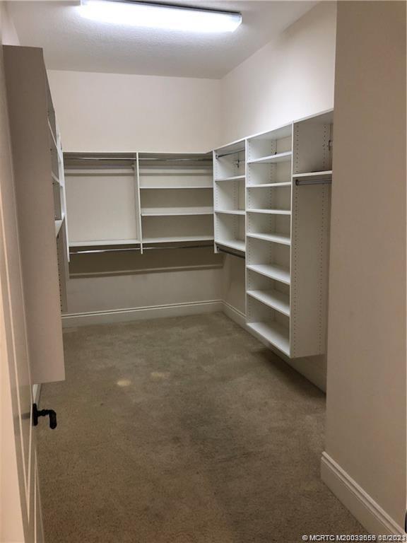 108 Tulip Tree Court Jupiter, FL 33458 - Photo 40 of 41 a view of walk in closet with empty racks
