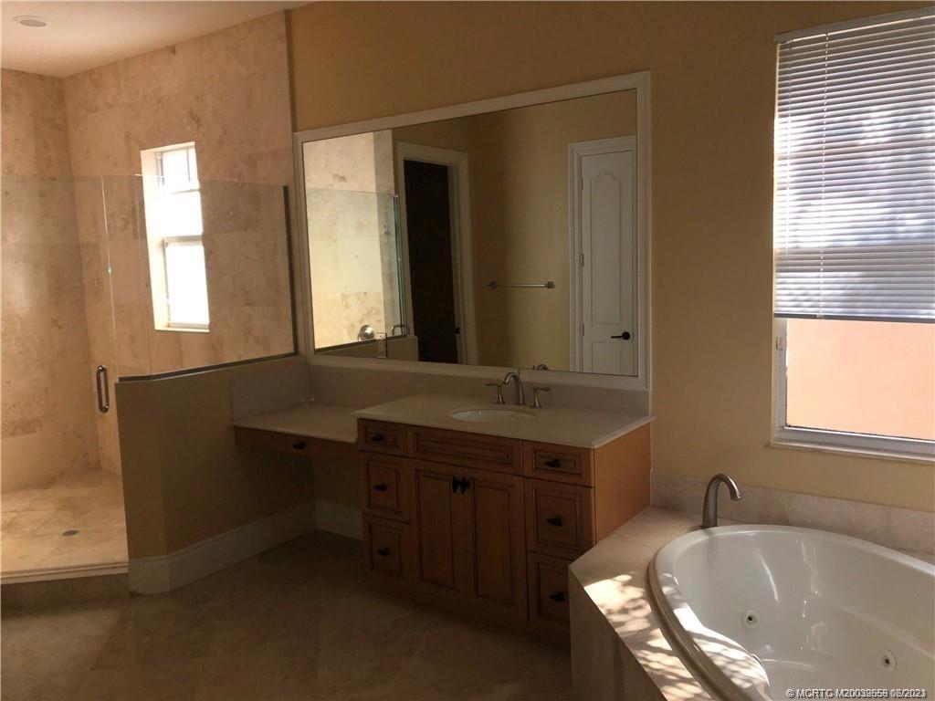 108 Tulip Tree Court Jupiter, FL 33458 - Photo 41 of 41 a bathroom with a sink and a bathtub