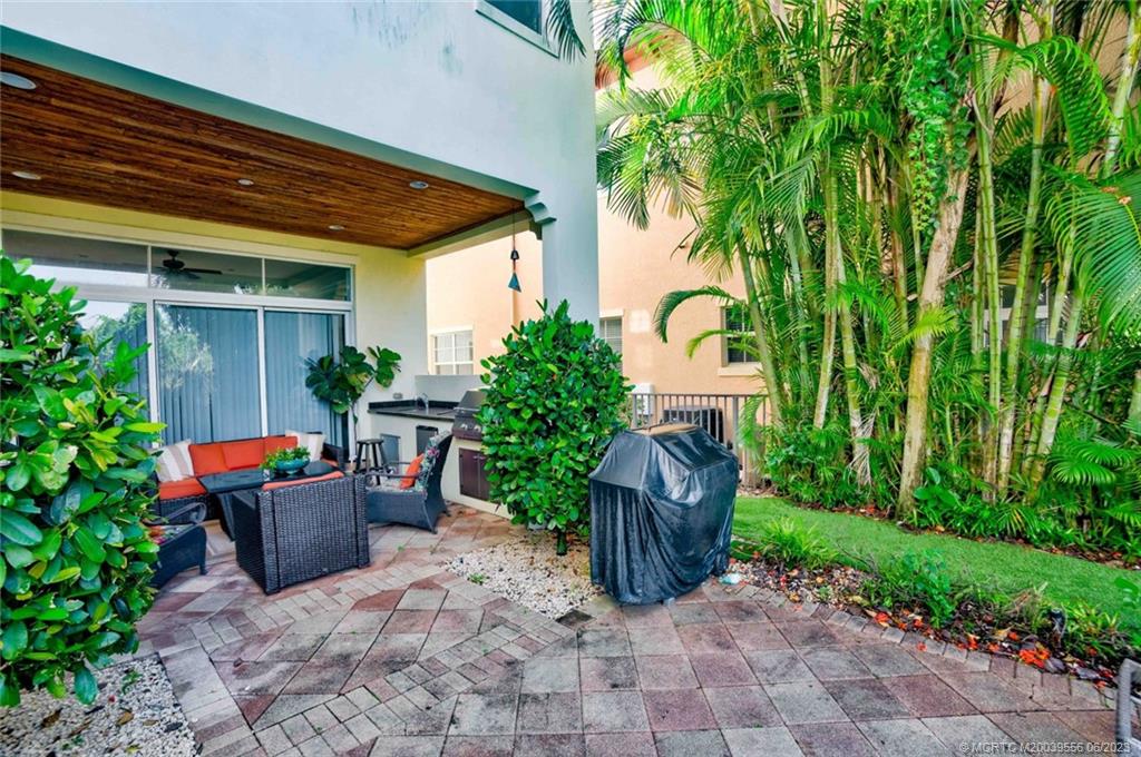 108 Tulip Tree Court Jupiter, FL 33458 - Photo 5 of 41 a view of a house with backyard and sitting area