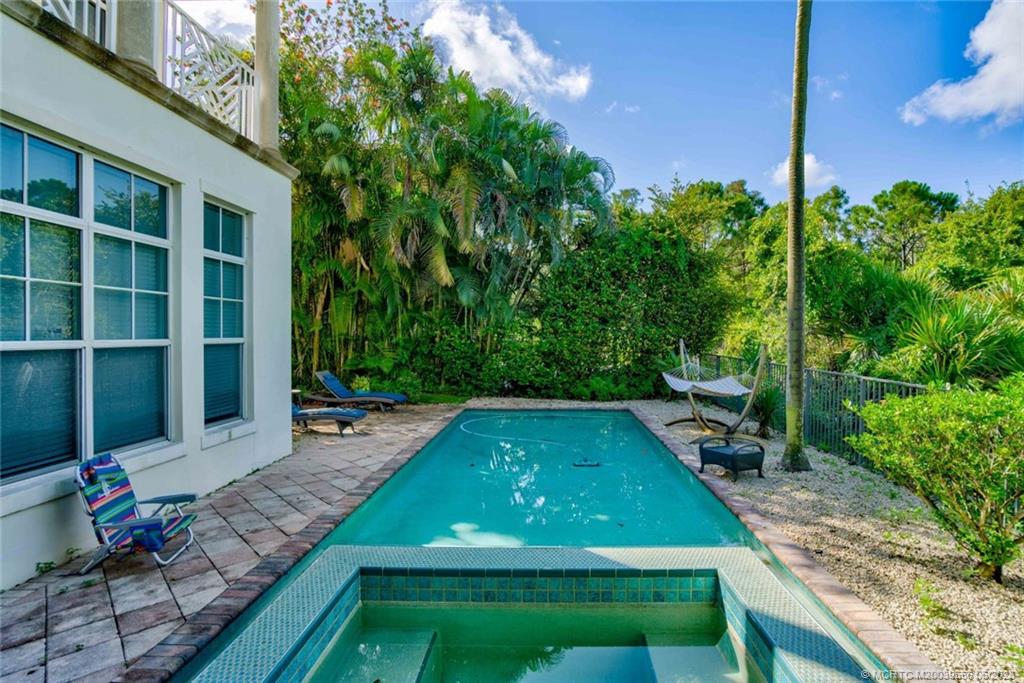 108 Tulip Tree Court Jupiter, FL 33458 - Photo 7 of 41 a view of a backyard with plants and outdoor seating