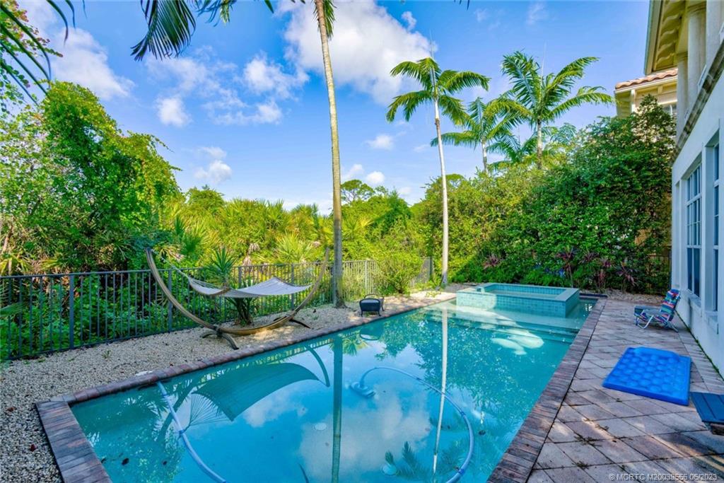 108 Tulip Tree Court Jupiter, FL 33458 - Photo 9 of 41 a view of a backyard with plants and a patio