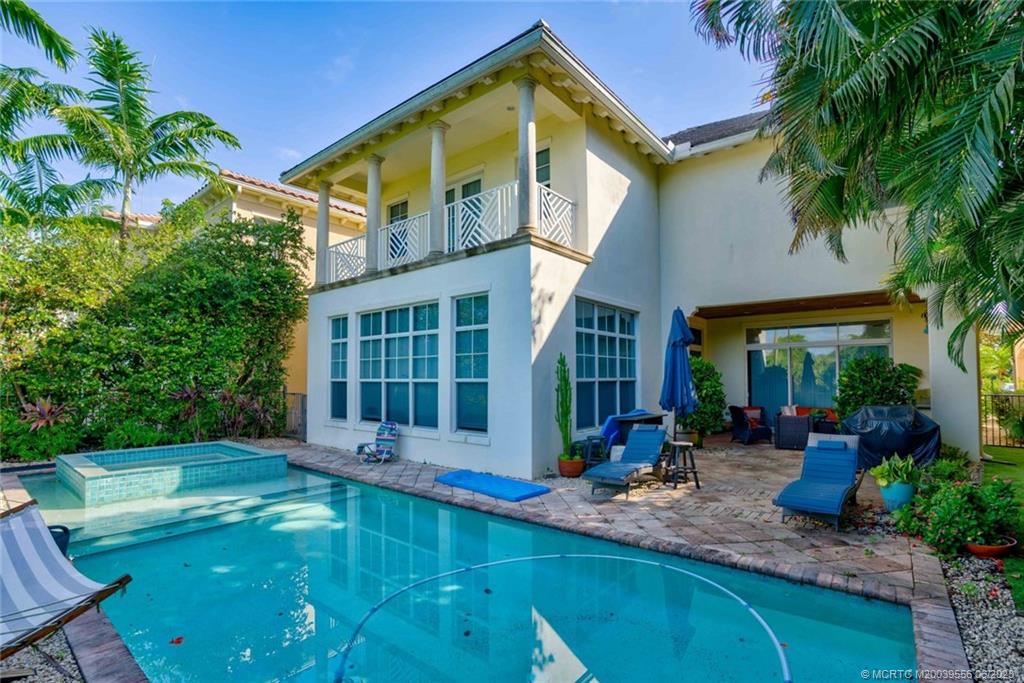 108 Tulip Tree Court Jupiter, FL 33458 - Photo 10 of 41 a view of a house with swimming pool patio and a garden