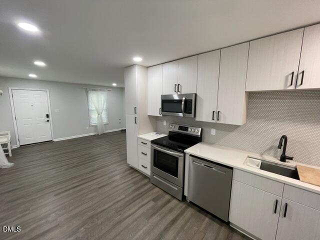 4804 Hoyle Drive, Unit A Raleigh, NC 27604 - Photo 7 of 19 a kitchen with a sink appliances and cabinets