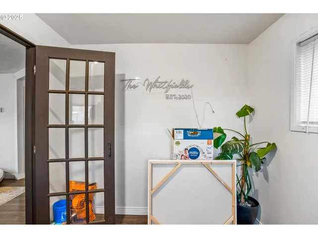 a fan room with furniture and a window