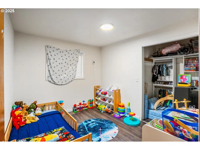 a bedroom with a bed and cabinets