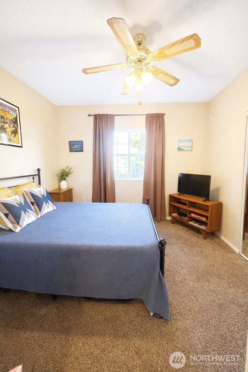 302 Centre Street North Rainier, WA 98576 - Photo 15 of 28 a bedroom with a bed and a chandelier