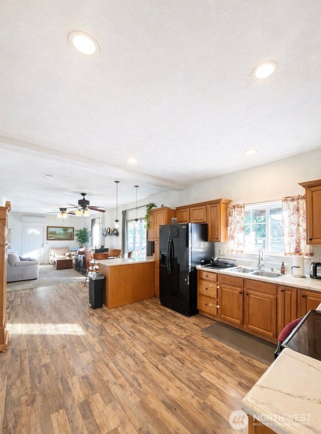 302 Centre Street North Rainier, WA 98576 - Photo 8 of 28 a kitchen with stainless steel appliances kitchen island granite countertop a refrigerator and stove