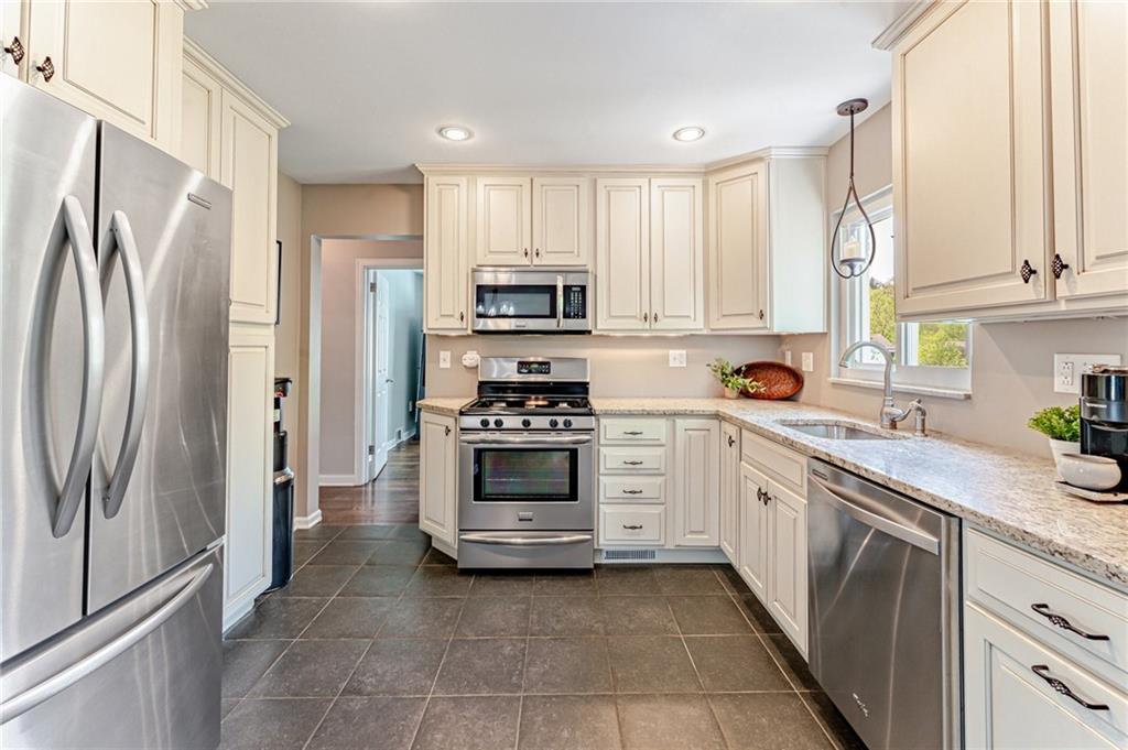 9475 Peebles Road Allison Park, PA 15101 - Photo 14 of 34 a kitchen with stainless steel appliances a refrigerator sink and cabinets