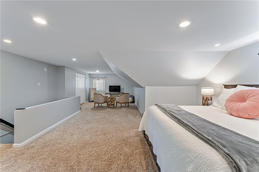 9475 Peebles Road Allison Park, PA 15101 - Photo 23 of 34 a spacious bedroom with a bed and a couch