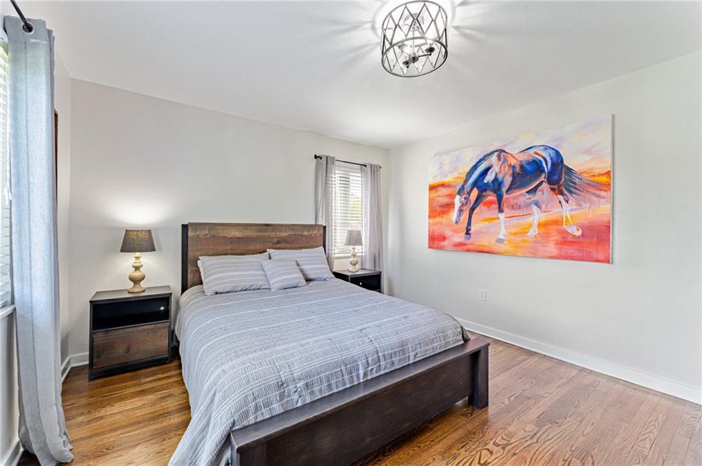 9475 Peebles Road Allison Park, PA 15101 - Photo 26 of 34 a bedroom with a bed and a chandelier