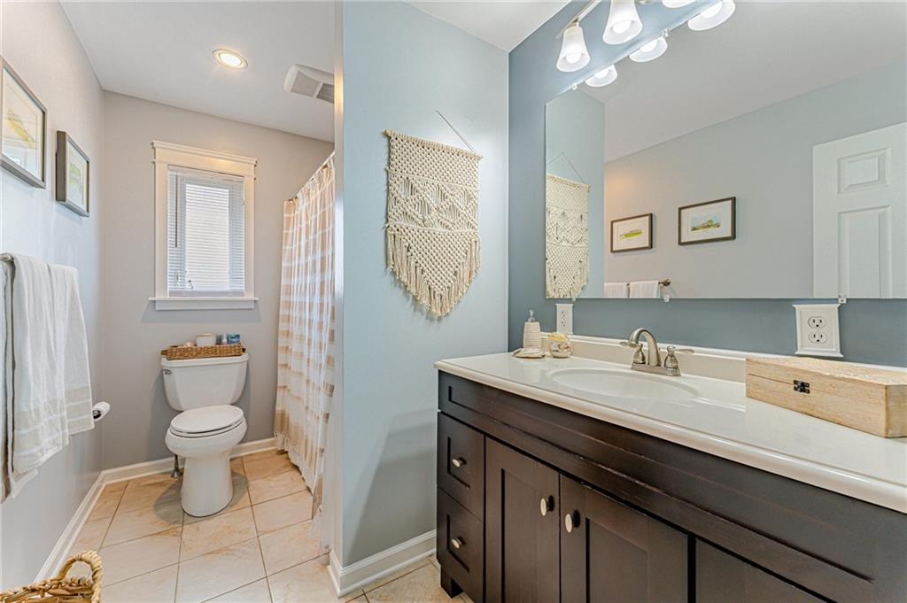 9475 Peebles Road Allison Park, PA 15101 - Photo 27 of 34 a bathroom with a sink vanity mirror and toilet