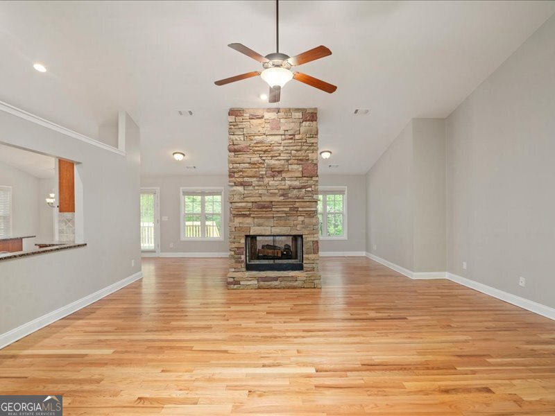 1406 Morgans Bluff Monroe, GA 30656 - Photo 13 of 80 a living room with fireplace and a fireplace