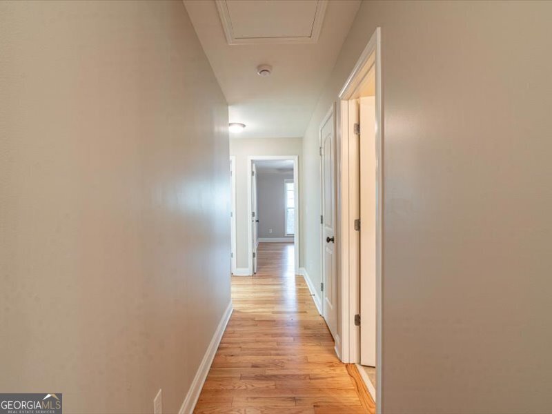 1406 Morgans Bluff Monroe, GA 30656 - Photo 23 of 80 a view of a hallway with wooden floor