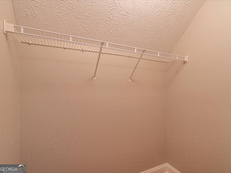 1406 Morgans Bluff Monroe, GA 30656 - Photo 26 of 80 a view of a room with racks on the wall
