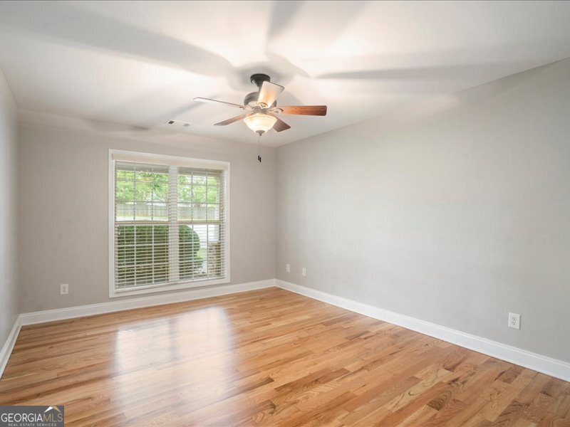 1406 Morgans Bluff Monroe, GA 30656 - Photo 28 of 80 wooden floor in an empty room with a window
