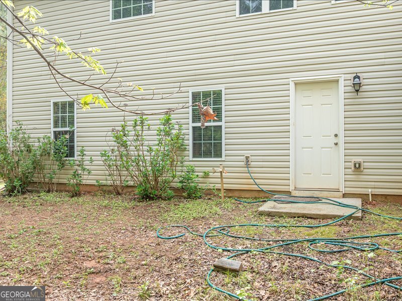 1406 Morgans Bluff Monroe, GA 30656 - Photo 71 of 80 a view of a house with a backyard