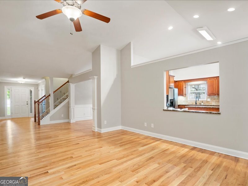 1406 Morgans Bluff Monroe, GA 30656 - Photo 9 of 80 a view of an empty room with wooden floor