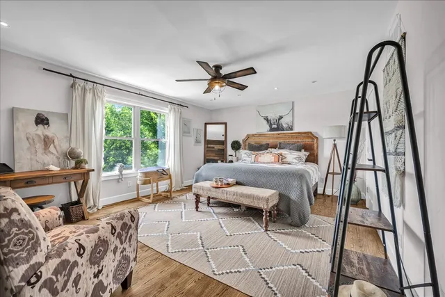 a bedroom with a bed and window