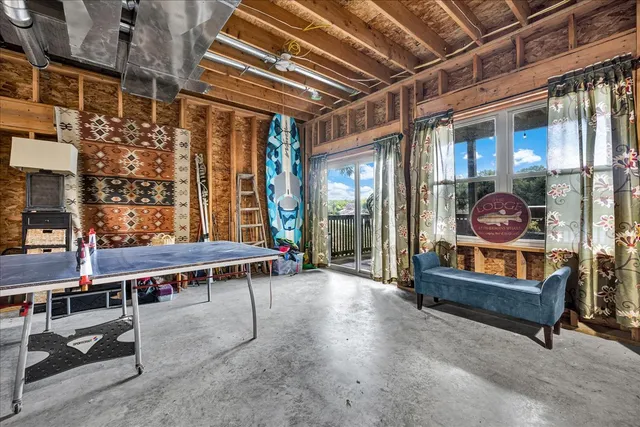 a view of balcony with couch and chairs