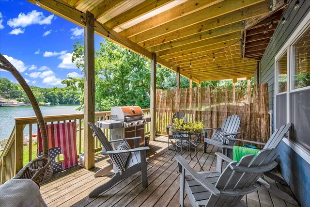 a view of a chairs and table in backyard of the house