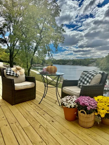 a view of a balcony with chairs