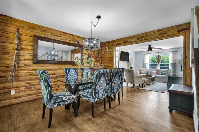 a view of a dining room with furniture window and wooden floor