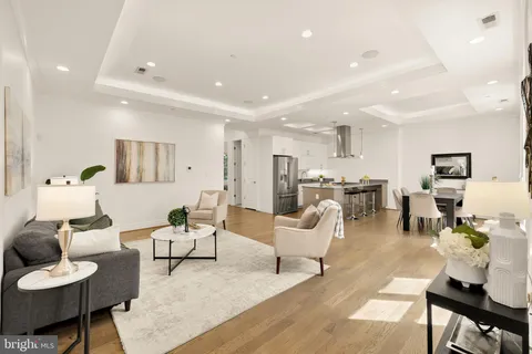 a living room with furniture and a table