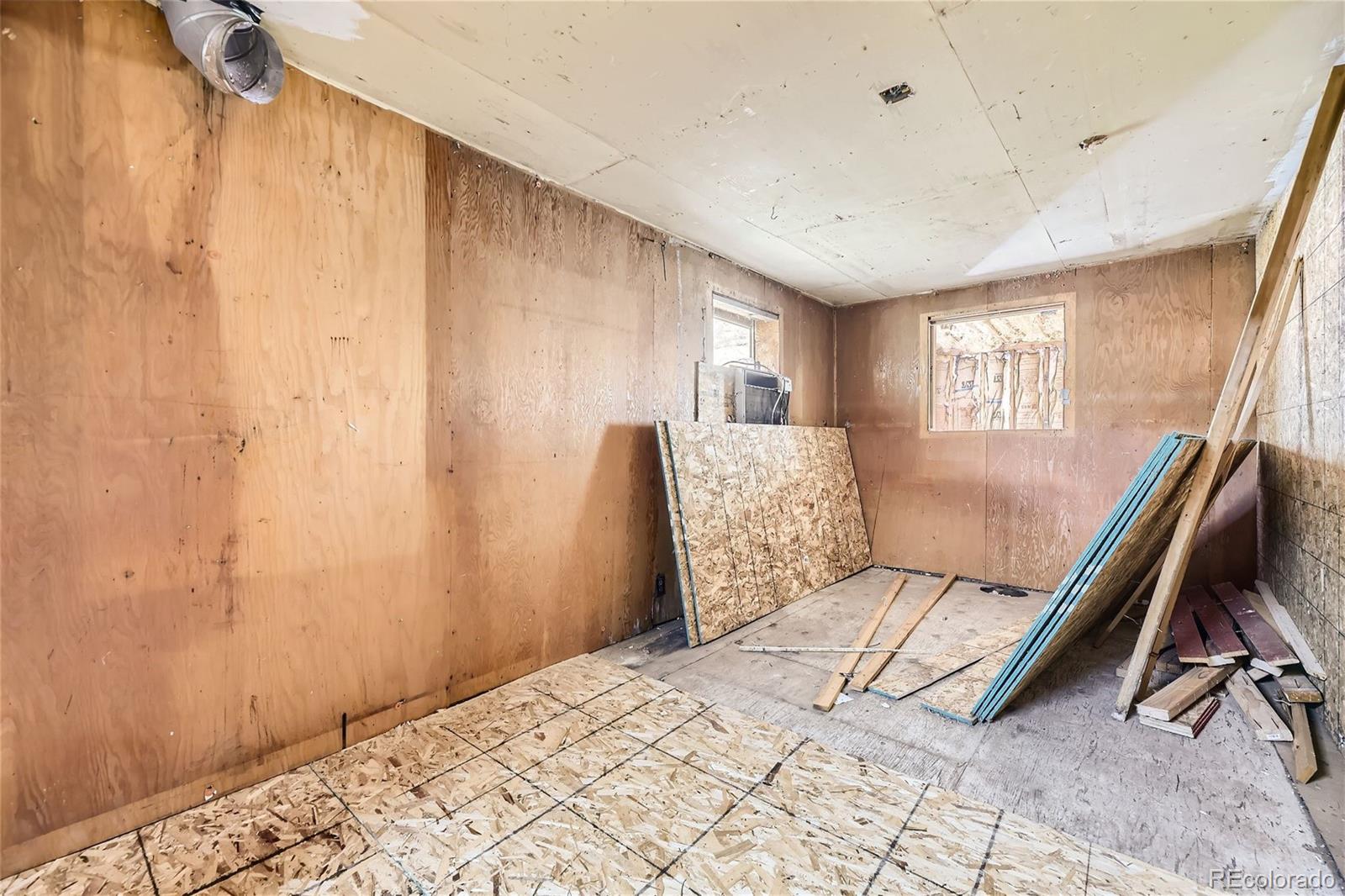 539 Neal Road Bailey, CO 80421 - Photo 17 of 26 a bedroom with a bed and furniture