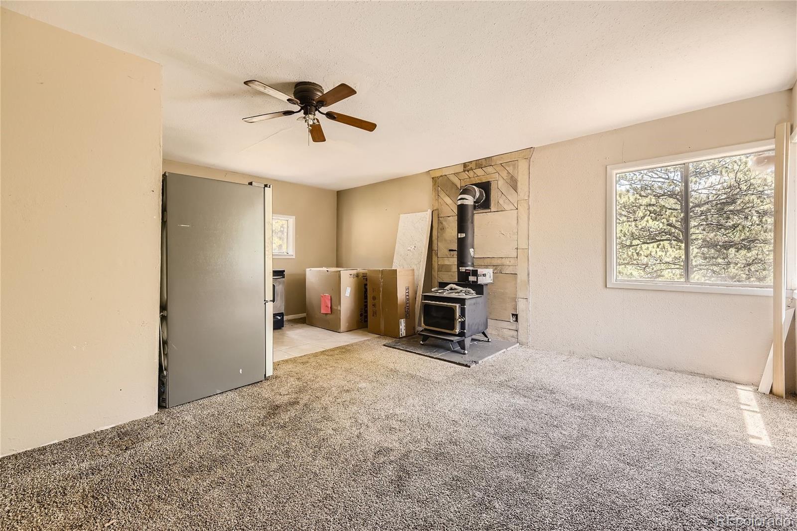 539 Neal Road Bailey, CO 80421 - Photo 3 of 26 a view of a livingroom with furniture and a window