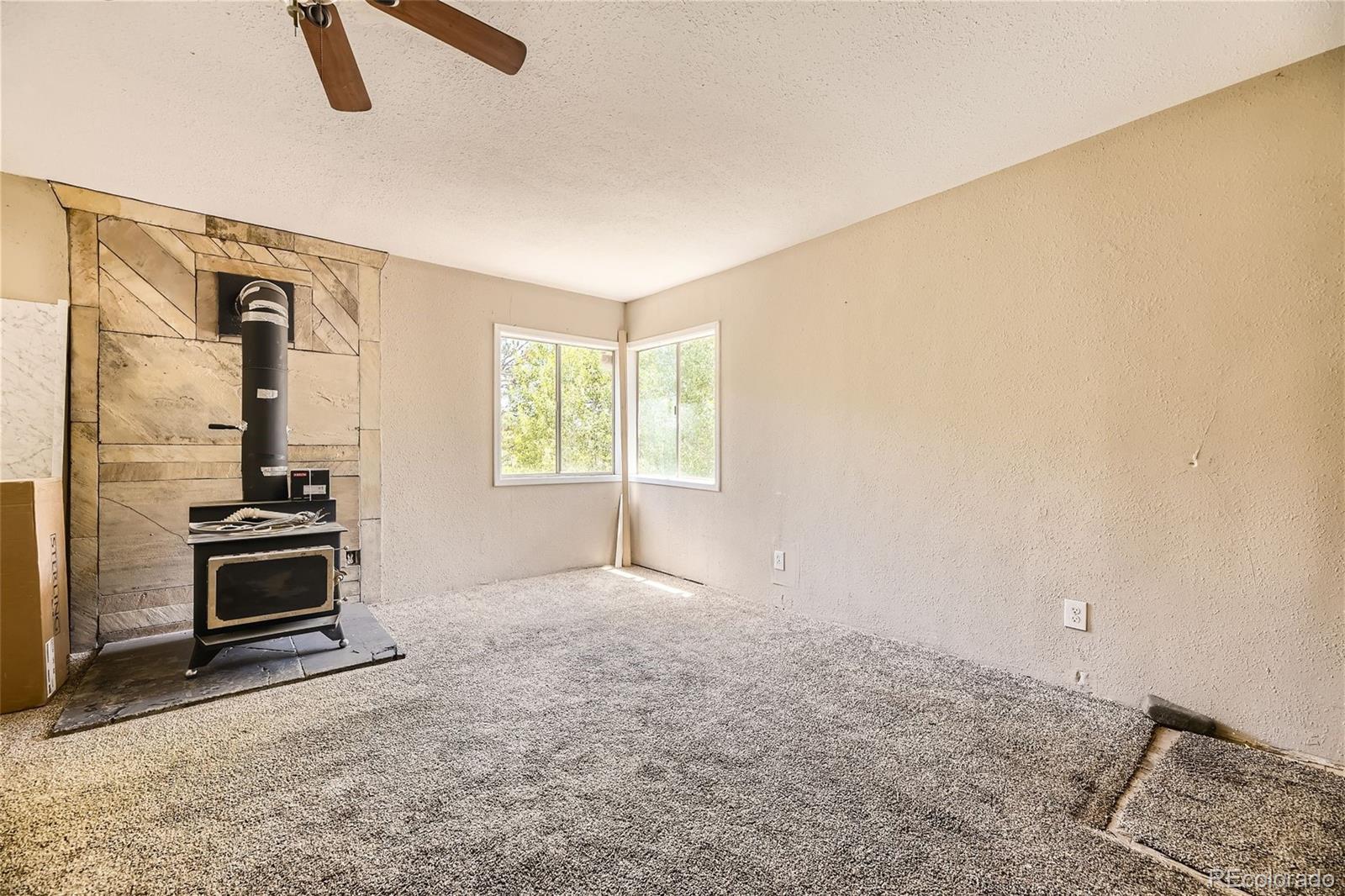 539 Neal Road Bailey, CO 80421 - Photo 4 of 26 a view of a kitchen with furniture wooden floor and window