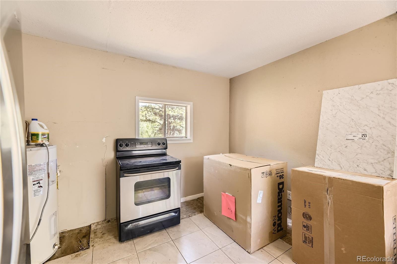 539 Neal Road Bailey, CO 80421 - Photo 6 of 26 a utility room with dryer and washer