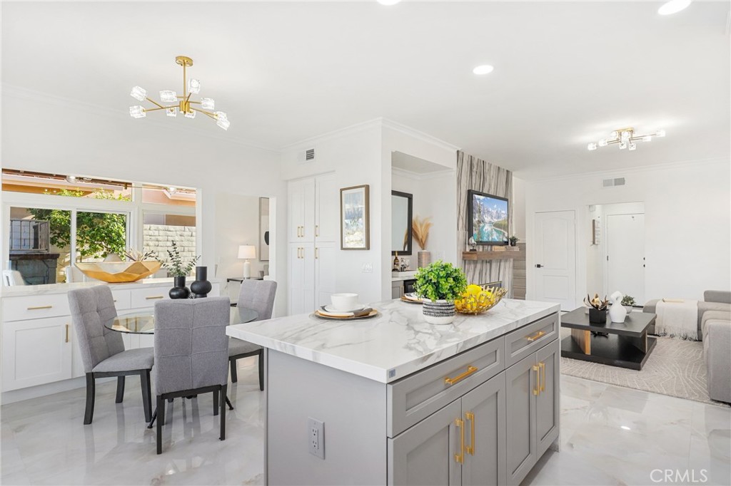 30352 Anamonte Laguna Niguel, CA 92677 - Photo 14 of 43 a view of a dining room with furniture a livingroom and chandelier