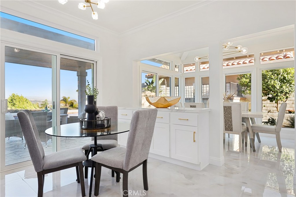 30352 Anamonte Laguna Niguel, CA 92677 - Photo 17 of 43 a dining room with furniture window and wooden floor