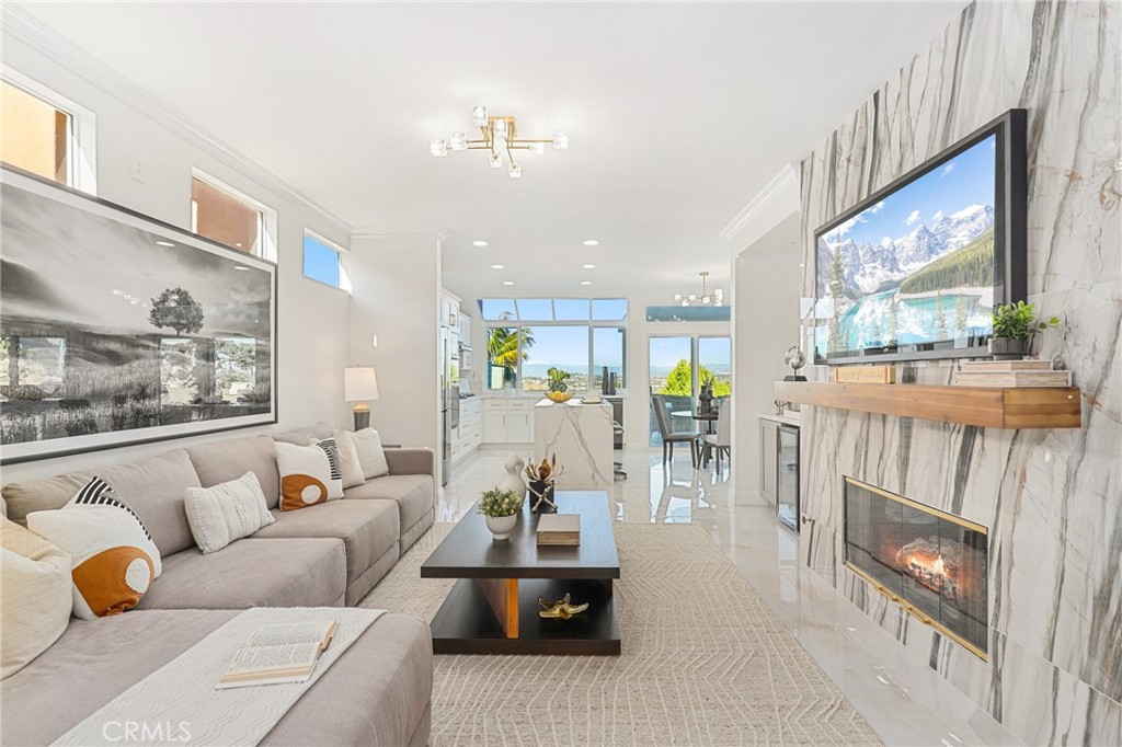 30352 Anamonte Laguna Niguel, CA 92677 - Photo 18 of 43 a living room with furniture and a fireplace