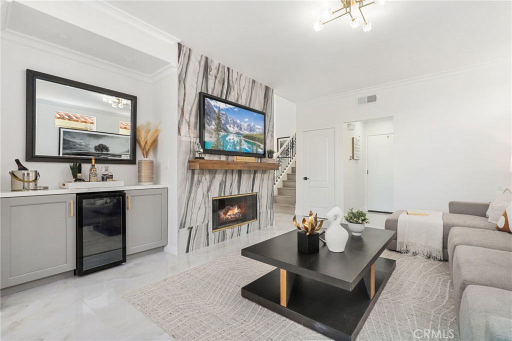 30352 Anamonte Laguna Niguel, CA 92677 - Photo 20 of 43 a living room with furniture a fireplace and a flat screen tv