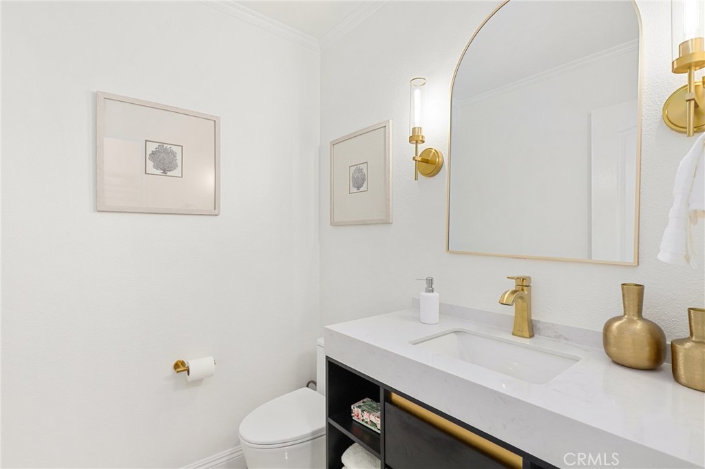 30352 Anamonte Laguna Niguel, CA 92677 - Photo 21 of 43 a bathroom with a granite countertop sink and a toilet