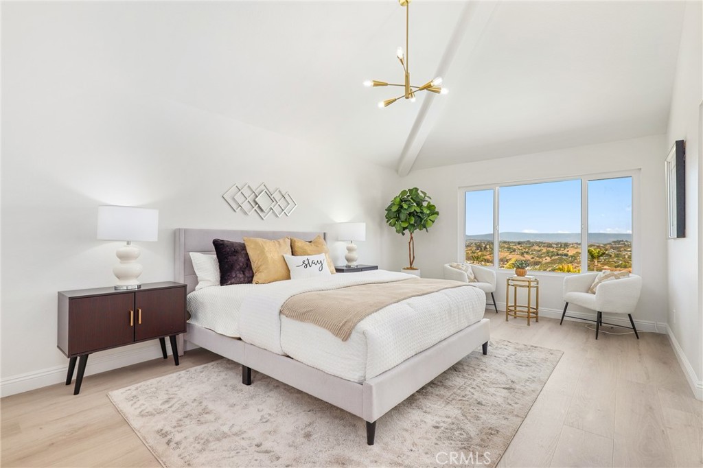 30352 Anamonte Laguna Niguel, CA 92677 - Photo 23 of 43 a bed room with a bed and a table