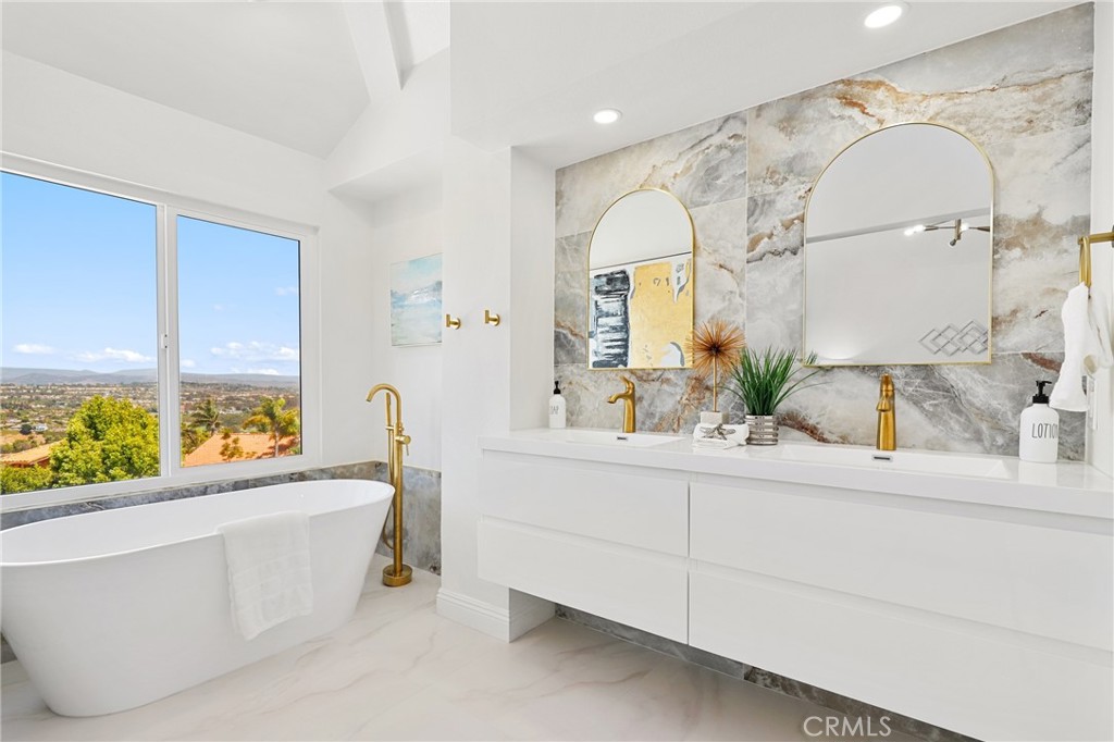 30352 Anamonte Laguna Niguel, CA 92677 - Photo 26 of 43 a bathroom with a sink mirror and a bathtub