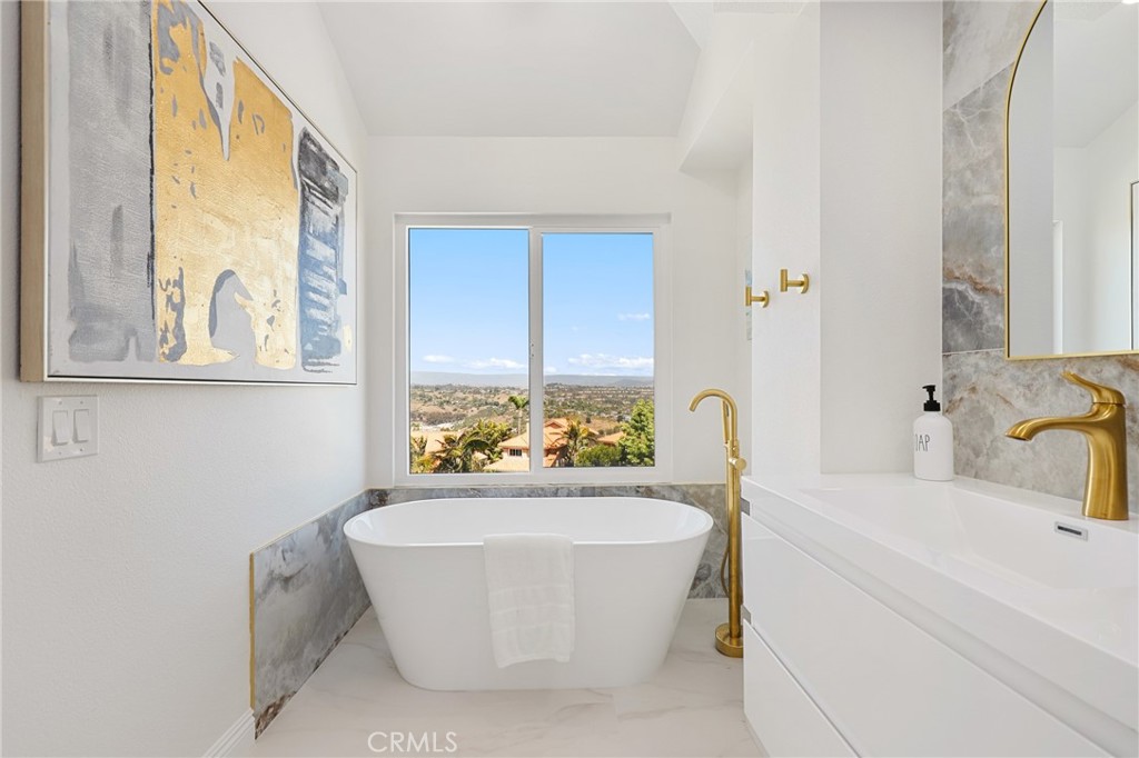 30352 Anamonte Laguna Niguel, CA 92677 - Photo 27 of 43 a white bath tub sitting next to a white sink