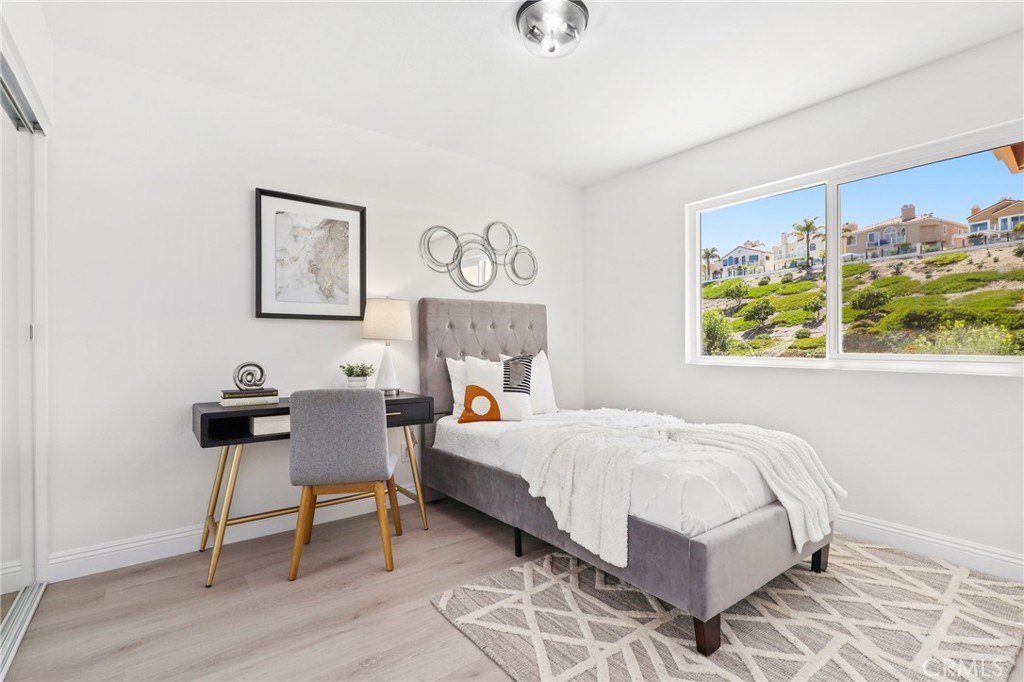 30352 Anamonte Laguna Niguel, CA 92677 - Photo 30 of 43 a bedroom with a bed and a table in it