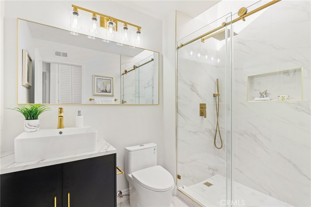 30352 Anamonte Laguna Niguel, CA 92677 - Photo 32 of 43 a bathroom with a sink a toilet and shower