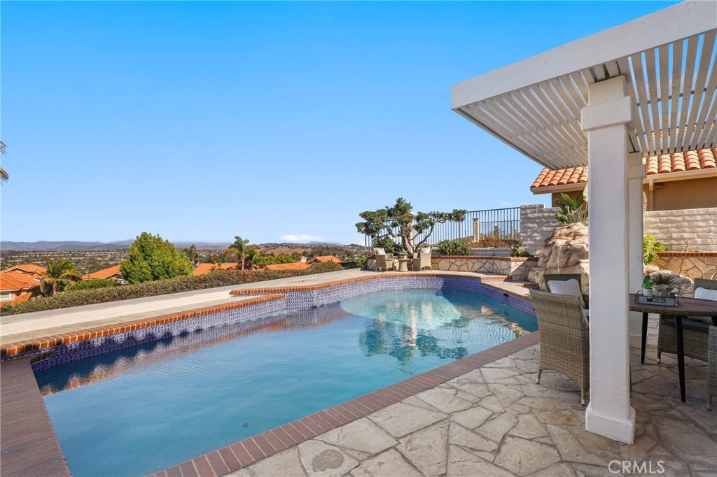 30352 Anamonte Laguna Niguel, CA 92677 - Photo 38 of 43 a view of a swimming pool with a lounge chair