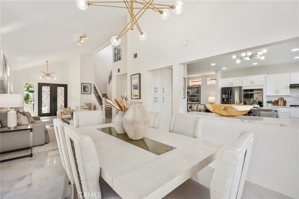 30352 Anamonte Laguna Niguel, CA 92677 - Photo 10 of 43 a living room with furniture kitchen view and a chandelier